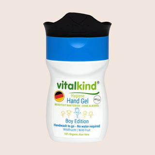 Vitalkind hand gel container with blue cap on a beige background