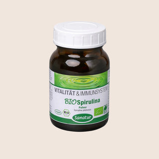 Bottle of Sanatur BIOSpirulina powder on a beige background