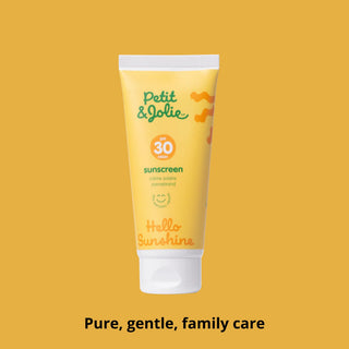 Tube of Petit Jolie sunscreen on a yellow background