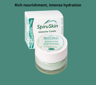 SpiruSkin Intensive Cream with packaging on a green background