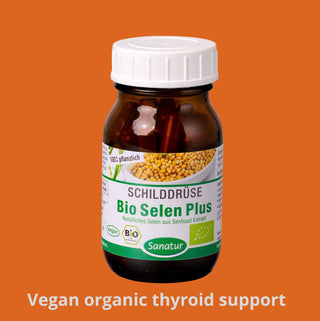 Vitamin supplement bottle with label on an orange background