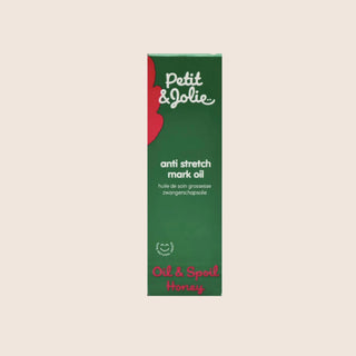 Petit & Jolie anti stretch mark oil packaging on a beige background