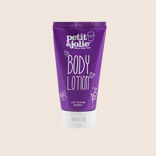 Purple body lotion tube with 'petit & jolie' branding on a beige background