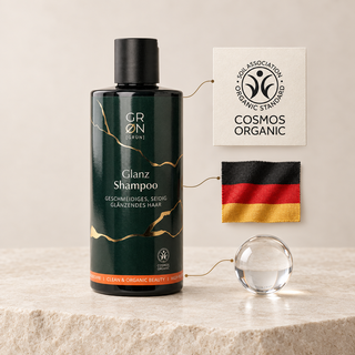 GRN Gloss Shampoo with a COSMOS Organic mark and German flag