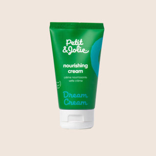 Green tube of Petit Jolie nourishing cream on a beige background